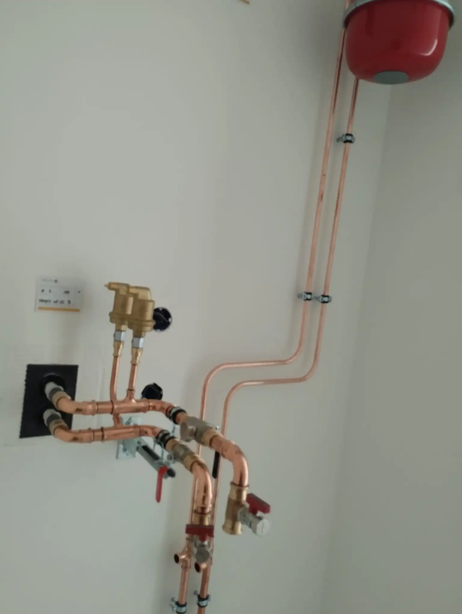 Exposed pipe routing and support brackets in a utility space